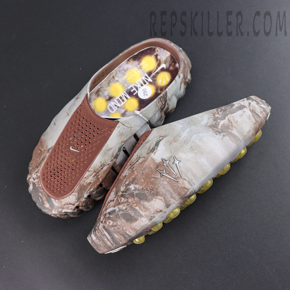 Drake NOCTA x Nike Mind 001 Bronze slip-on shoes top view featuring a brown camouflage upper with yellow cushioning pods