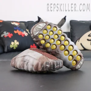 Drake NOCTA x Nike Mind 001 Bronze outsole view featuring the signature yellow circular cushioning pods