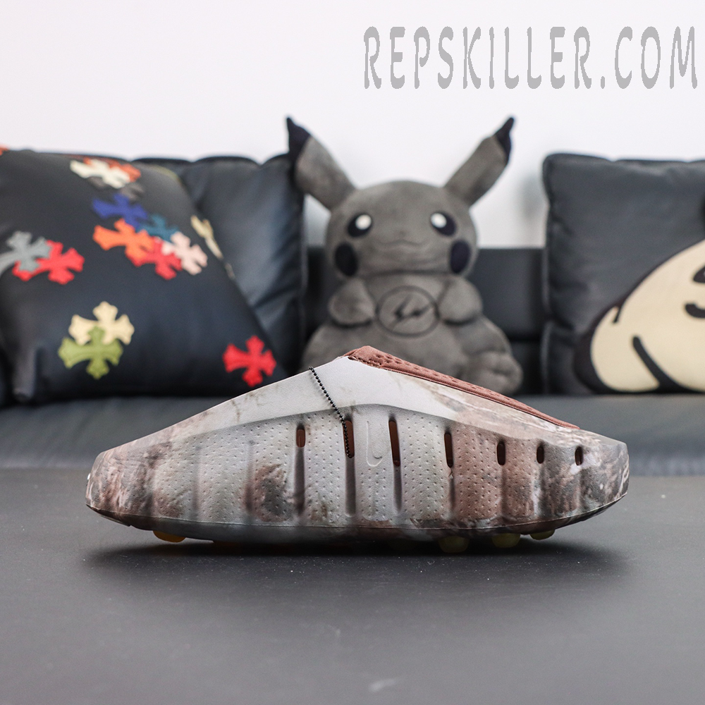 Drake NOCTA x Nike Mind 001 Bronze side view featuring perforated brown panels combined with a natural camouflage pattern