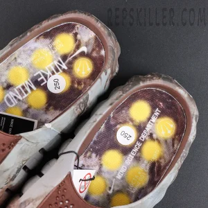 Drake NOCTA x Nike Mind 001 Bronze insole detail featuring NOCTA branding with yellow visual accents and futuristic styling
