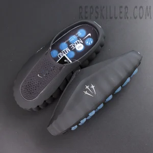 Drake NOCTA x Nike Mind 001 ‘Black’ top view featuring a breathable black upper, mini Swoosh, and blue cushioned footbed for all-day comfort