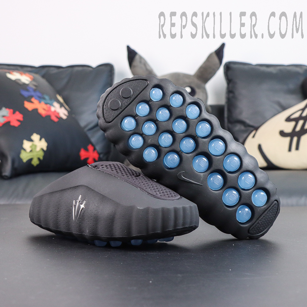 Drake NOCTA x Nike Mind 001 ‘Black’ outsole view featuring a black sole with blue circular cushioning pods for stable traction and lasting comfort