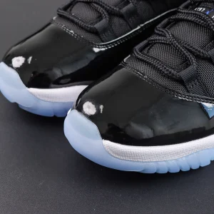 Jordan 11 Retro ‘Space Jam’ toe box detail featuring glossy patent leather and signature lacing system