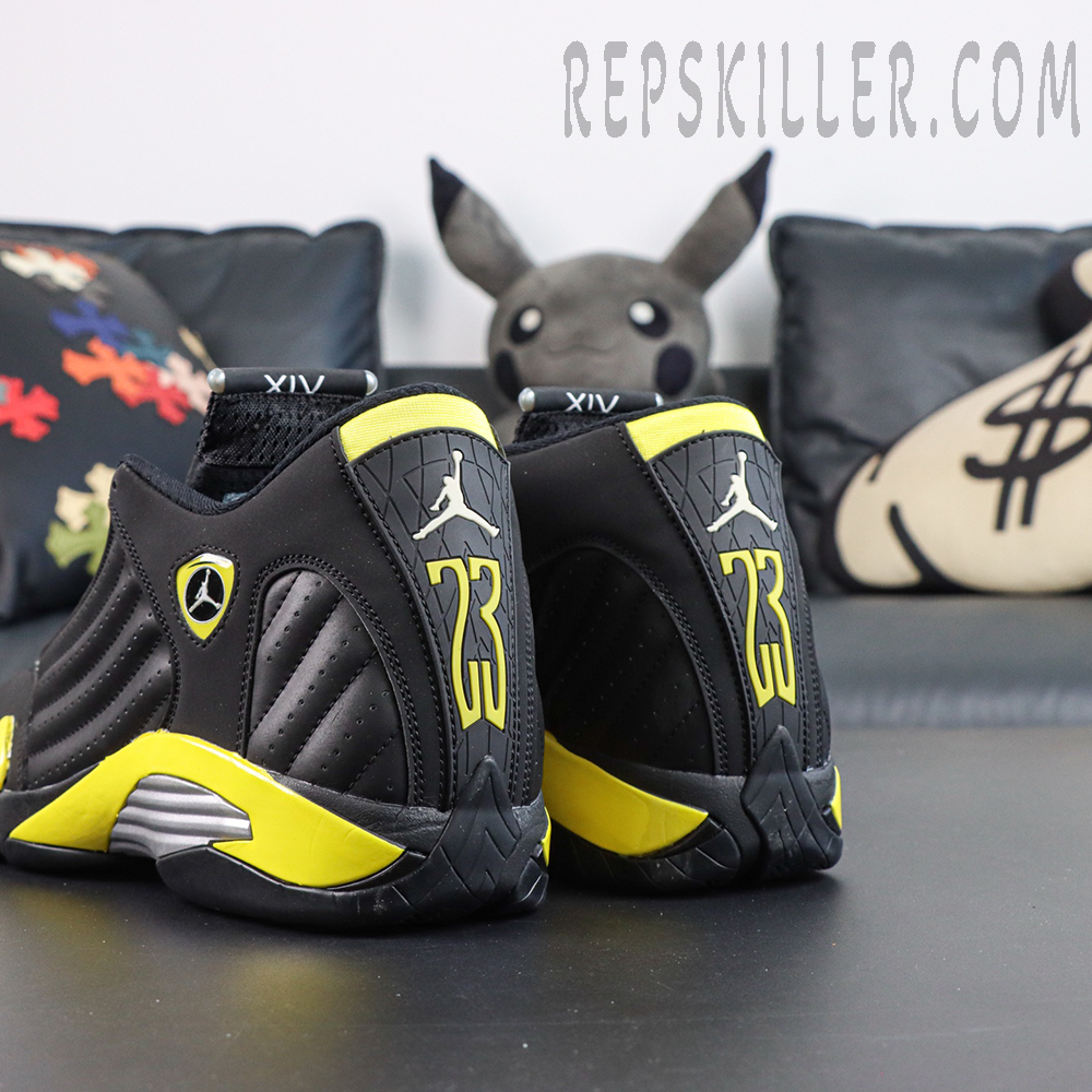 Jordan 14 Retro ‘Thunder’ heel view featuring yellow 23 branding and Jumpman logo on a black silhouette