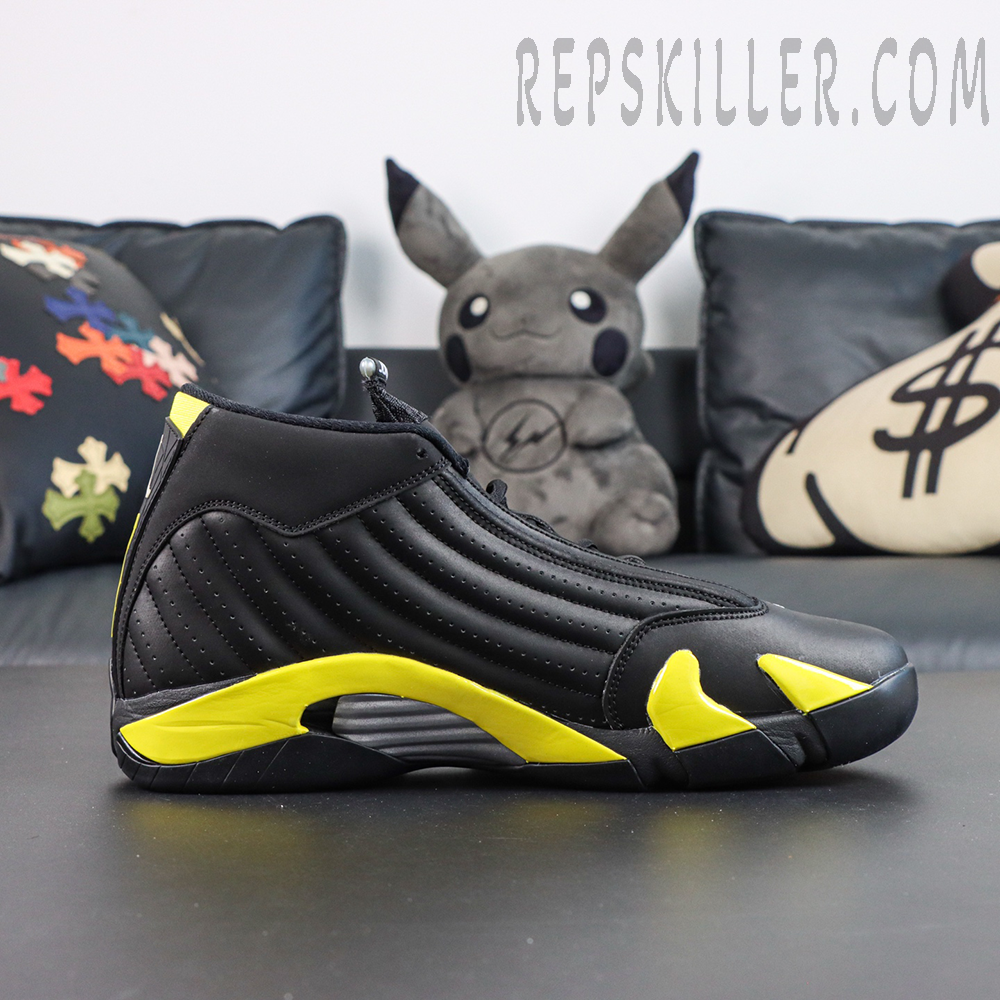 Jordan 14 Retro ‘Thunder’ side profile featuring a black leather upper, yellow midsole accents, and silver support detailing