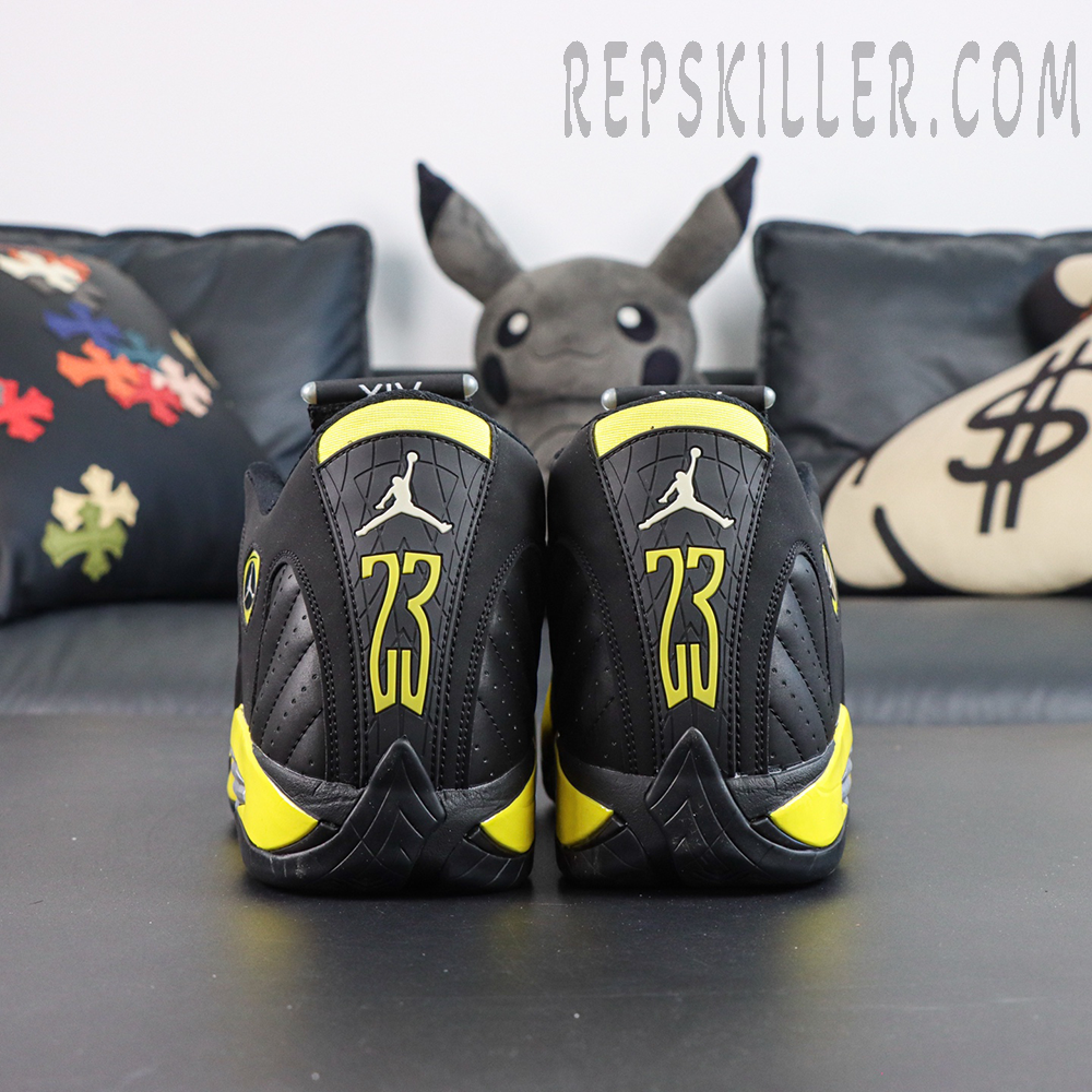 Jordan 14 Retro ‘Thunder’ rear detail featuring bold yellow 23 branding and textured black heel panel