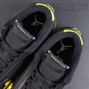 Jordan 14 Retro ‘Thunder’ tongue and collar detail featuring Jordan branding with black construction and yellow accents