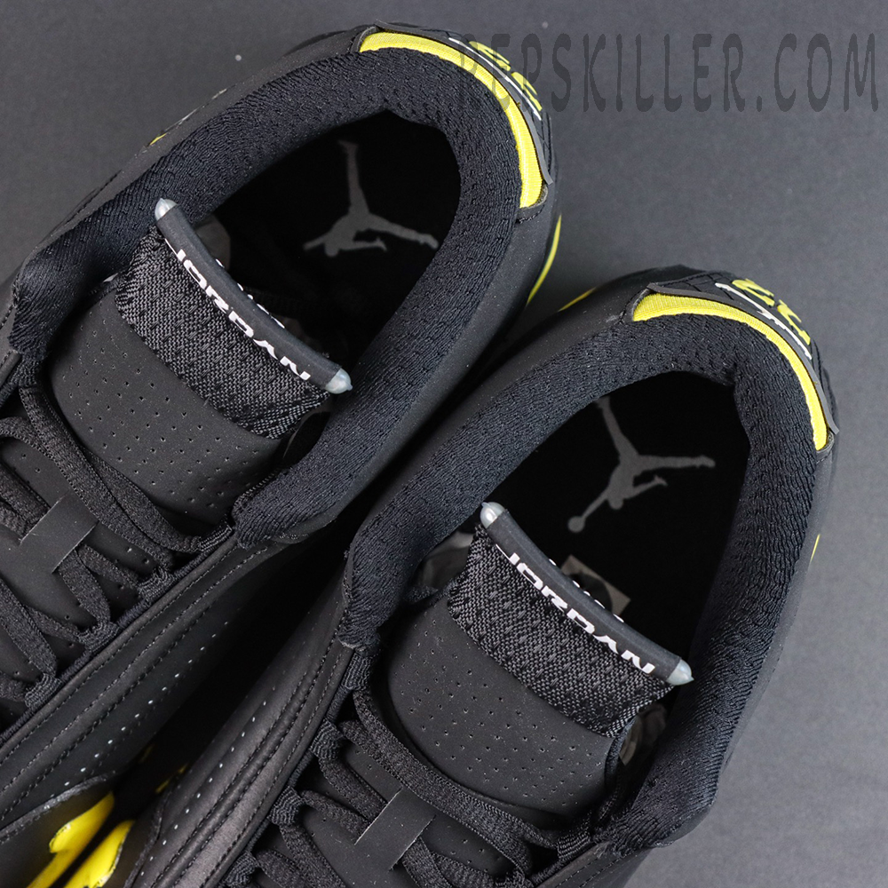 Jordan 14 Retro ‘Thunder’ tongue and collar detail featuring Jordan branding with black construction and yellow accents