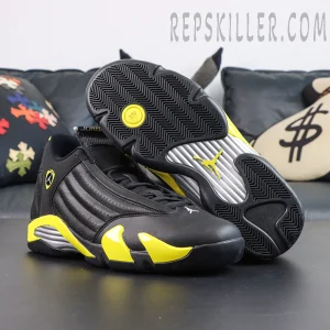Jordan 14 Retro ‘Thunder’ outsole view featuring black traction patterns, yellow stability pod, and Jumpman branding