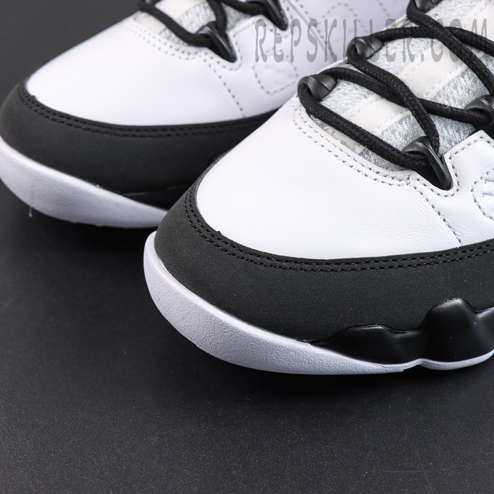 Jordan 9 Retro OG ‘Space Jam’ toe box detail featuring premium white leather with black mudguard trim