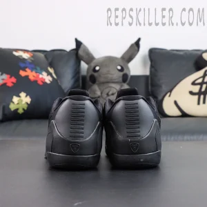 Kobe 9 Elite Low EM TB P Black heel view featuring the Kobe logo and structured support design