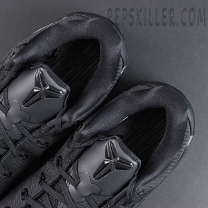 Kobe 9 Elite Low EM TB P Black tongue detail featuring Kobe branding with an all-black basketball shoe design