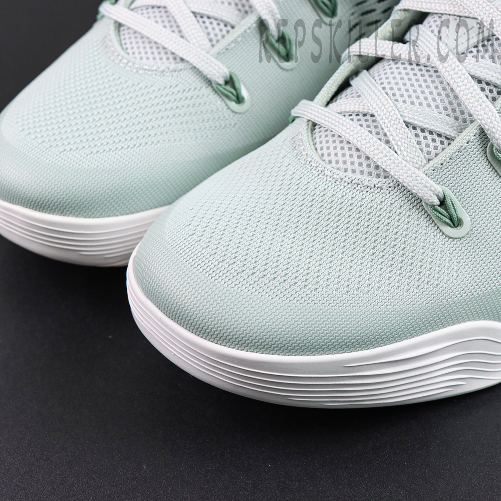 Kobe 9 Low EM Protro “Light Silver” toe box detail highlighting the fine engineered mesh construction with white laces for lightweight breathability