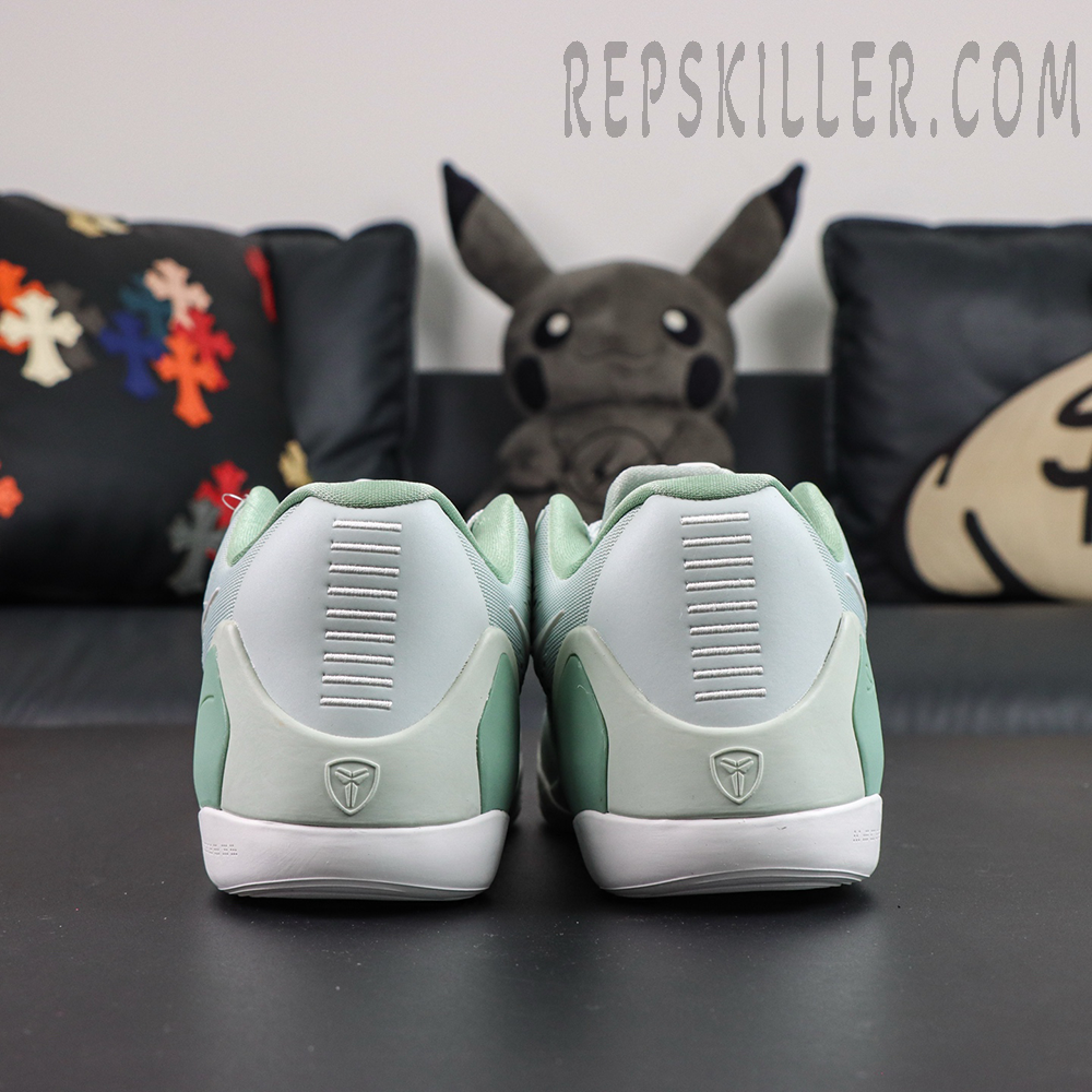 Kobe 9 Low EM Protro “Light Silver” rear view highlighting the sculpted heel support structure with subtle Kobe branding details