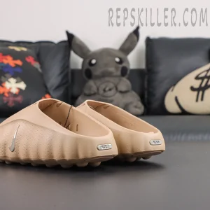 Nike Mind 001 ‘Hemp’ rear quarter view featuring tan construction with metallic Swoosh and Nike Mind branding