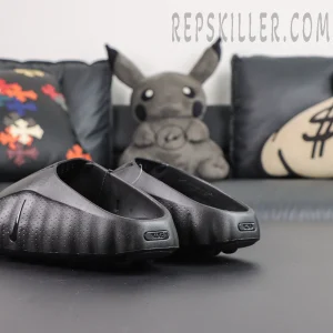 Nike Mind 001 ‘Triple Black’ rear quarter view featuring minimalist all-black styling with lightweight cushioned sole