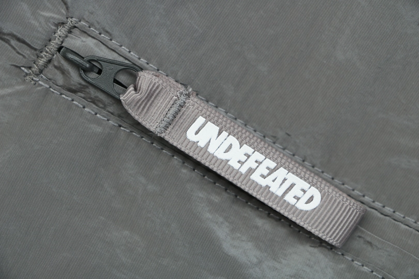Undefeated Five Stripes Woven Shorts Grey Zipper puller
