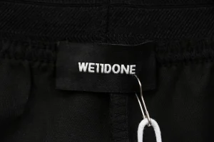We11done Slash Logo Tailored Wide-Leg Pants Brand label