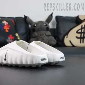 Nike WMNS Mind 001 “Summit White” rear side view featuring a one-piece white foam construction with metallic Swoosh and metallic Nike heel badge