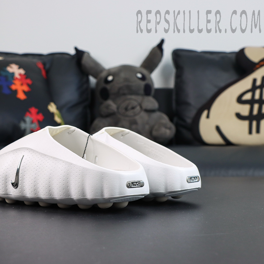 Nike WMNS Mind 001 “Summit White” rear side view featuring a one-piece white foam construction with metallic Swoosh and metallic Nike heel badge