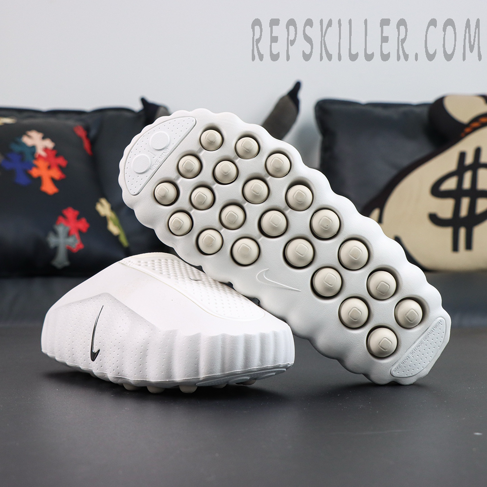 Nike WMNS Mind 001 “Summit White” outsole view featuring a rounded pod traction pattern designed for cushioning, comfort, and reliable grip