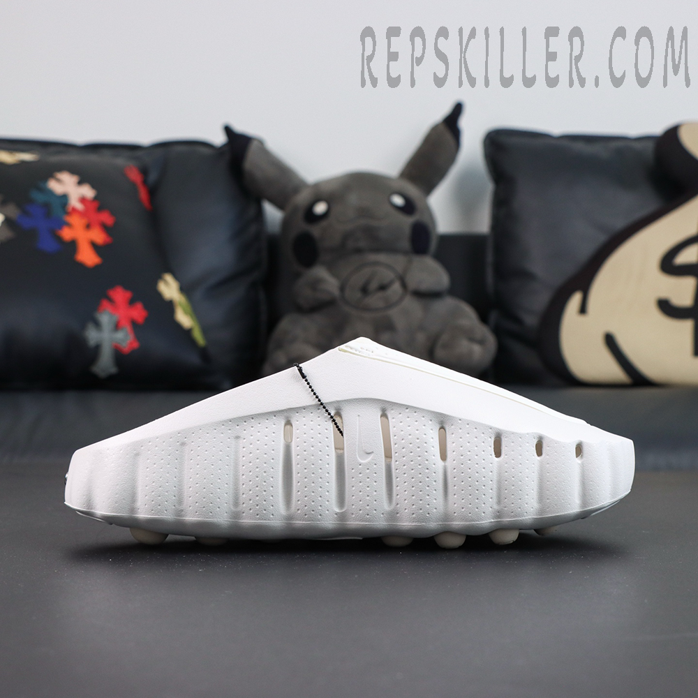 Nike WMNS Mind 001 “Summit White” lateral side view featuring a streamlined white silhouette with ventilation ports for lightweight everyday comfort