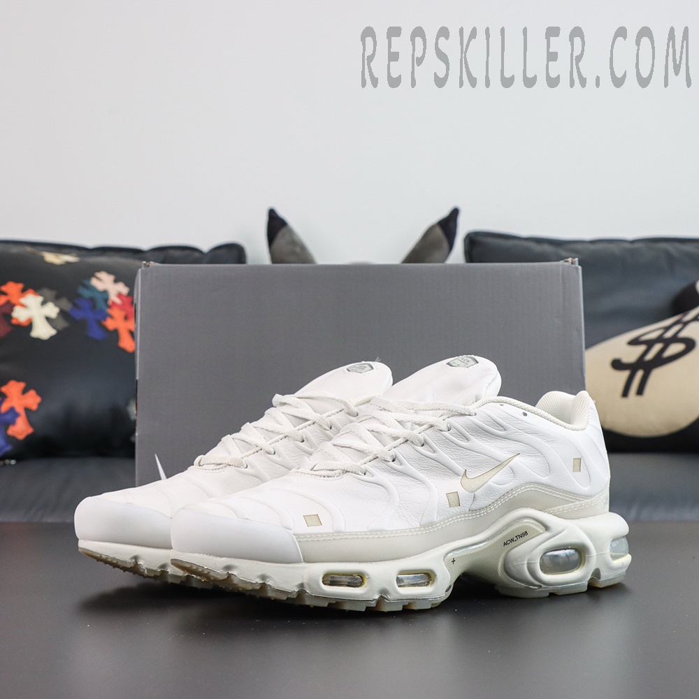 A-COLD-WALL x Nike Air Max Plus ‘Platinum Tint’ pair angle view featuring a minimalist white leather upper, ACW collaboration details, and classic Tuned Air cushioning