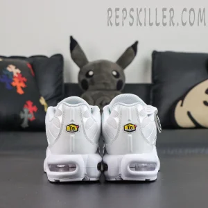 Nike Air Max Plus ‘Triple White’ heel view featuring an all-white upper, yellow-black Tn Air badges, and visible Max Air cushioning