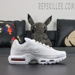Nike Air Max Plus ‘Triple White’ side view featuring white mesh, a silver Swoosh, wave-shaped TPU overlays, and visible Air cushioning