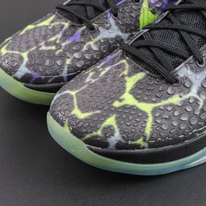 Nike Kobe 6 Protro ‘Coals’ toe close-up featuring a black scaled texture upper with volt green graphic detailing